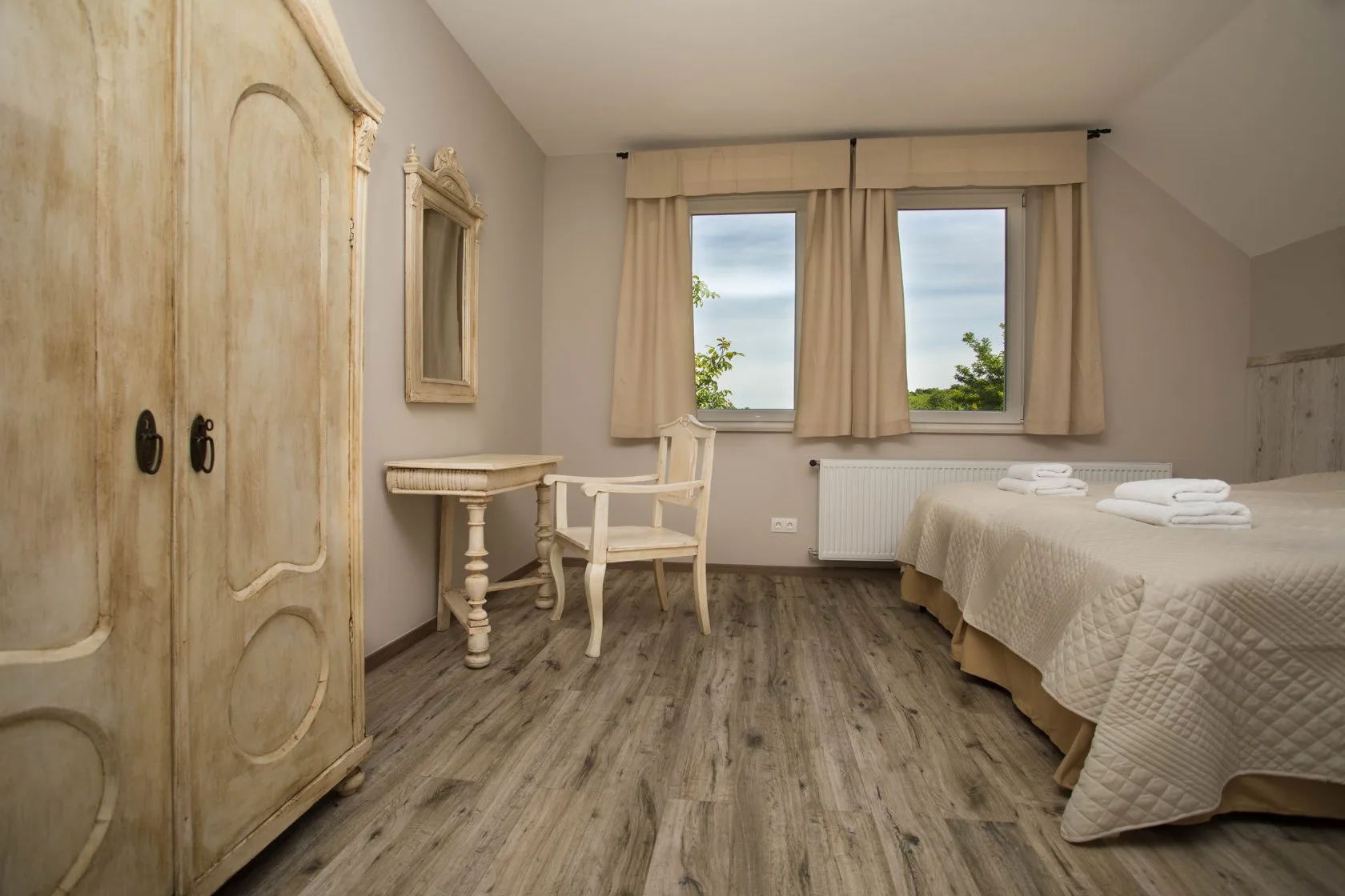 Gallery apartment double bedroom with antique wardrobe