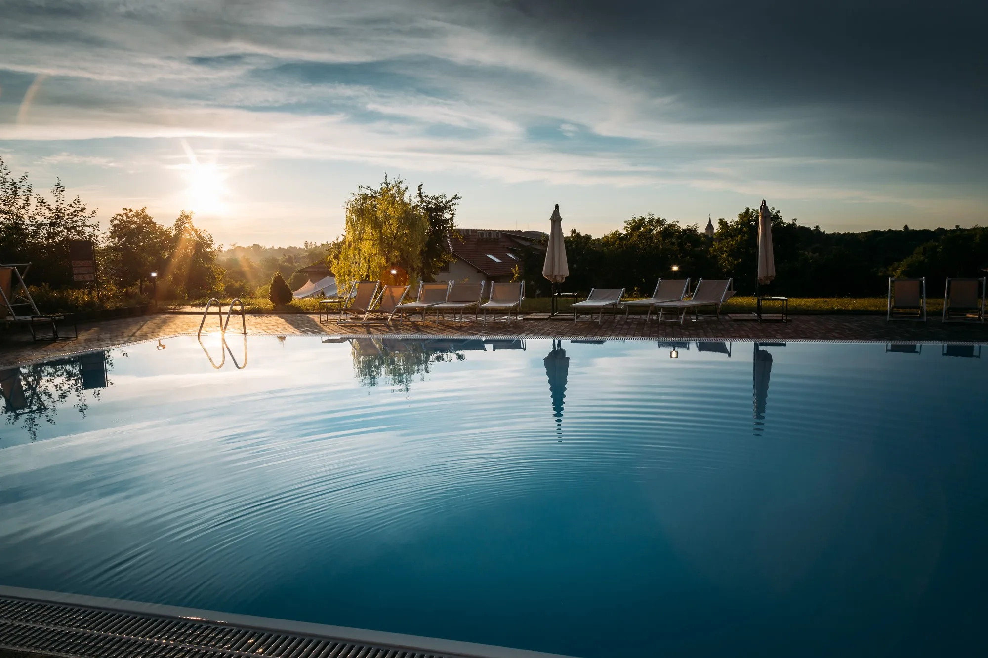 Outdoor pool at sunset